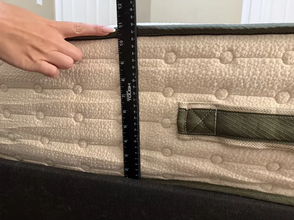 Measuring the height of the Avocado Green Mattress with a ruler