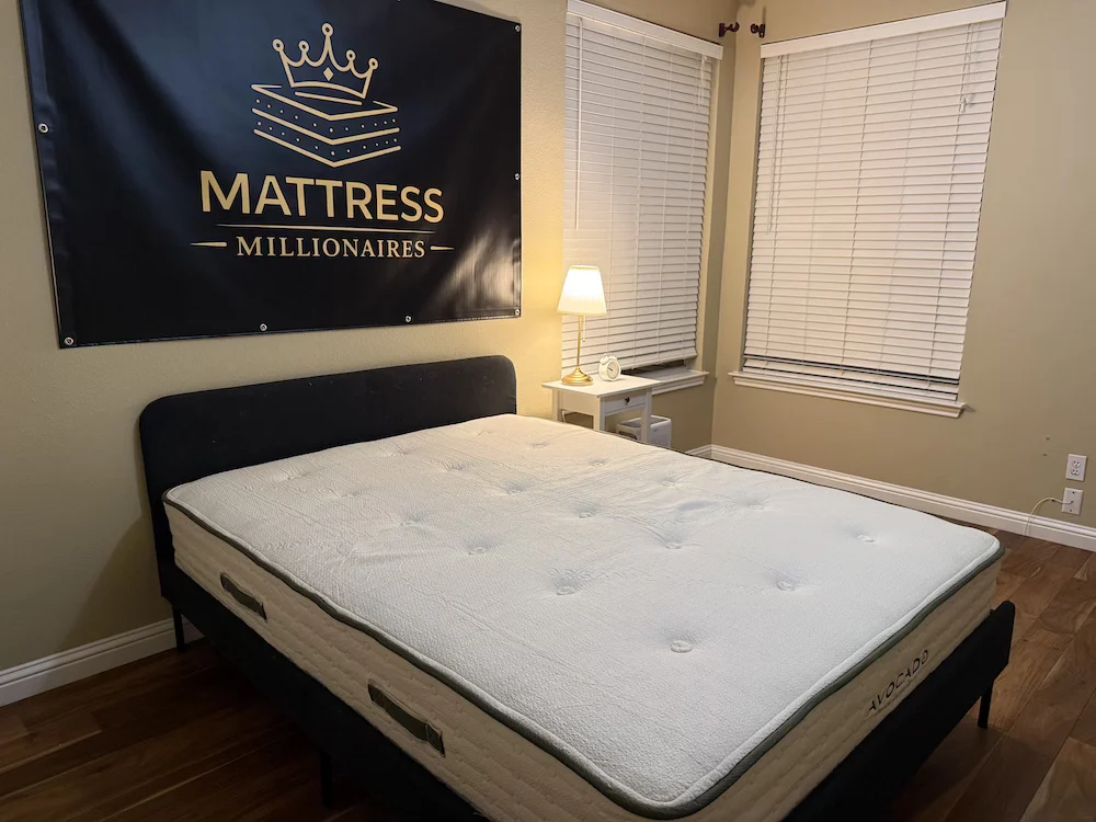 Avocado Green Mattress set up in the Mattress Millionaires testing room