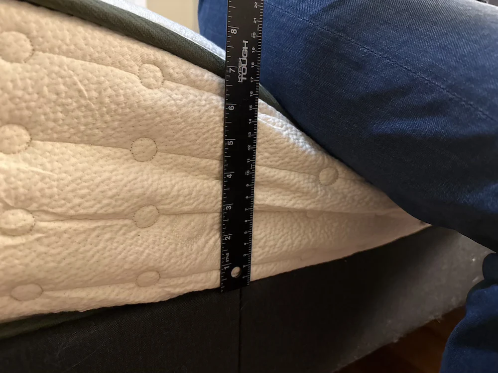 Measuring seated edge compression on the Avocado Green mattress