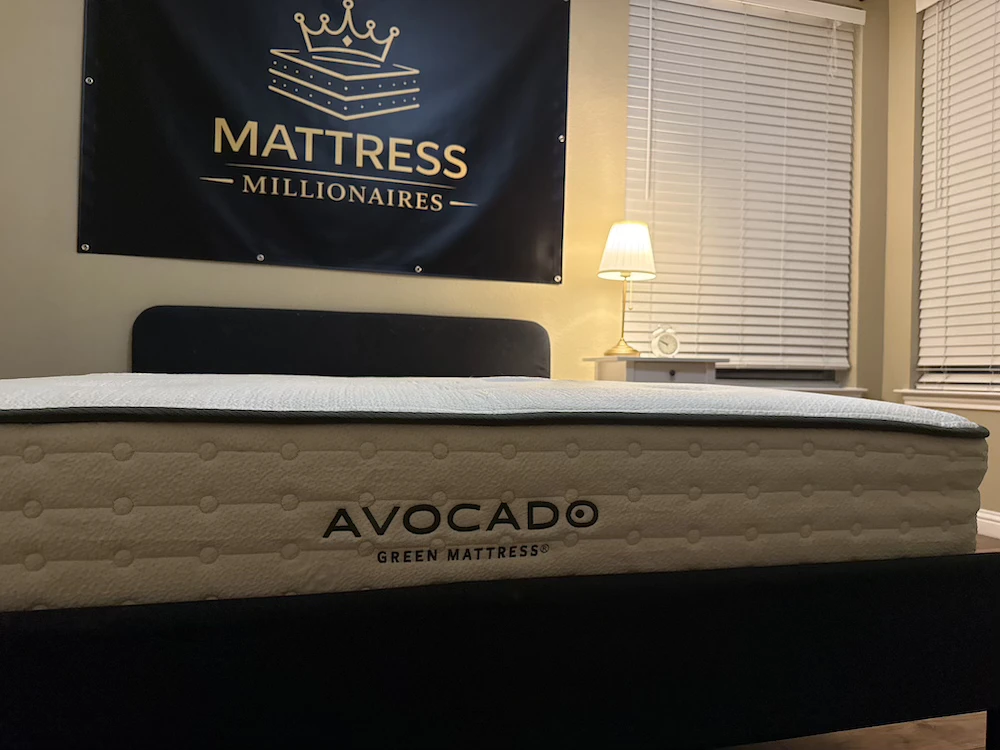 Side profile and logo on the Avocado Green Medium mattress