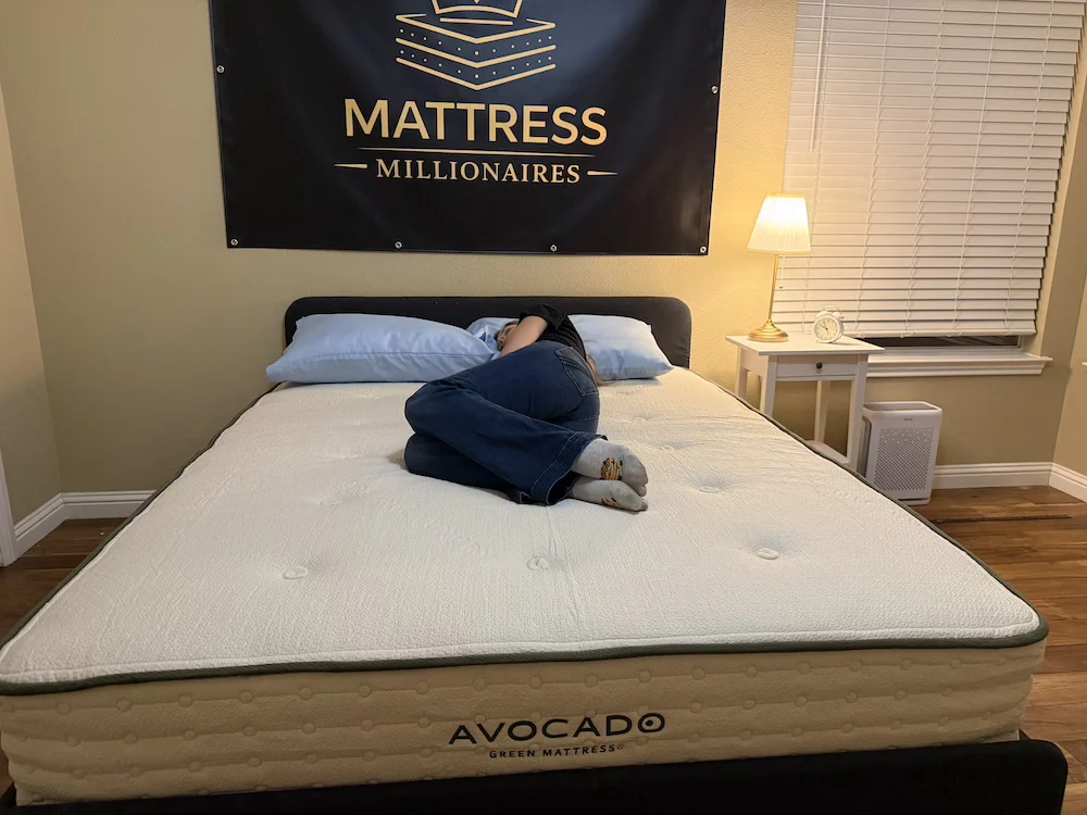 Side sleeper testing pressure relief on the Avocado Green Medium mattress