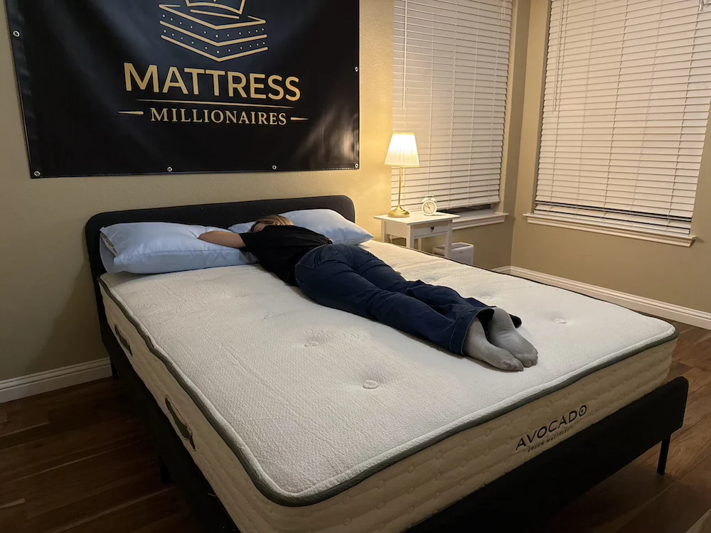 Stomach sleeper testing the Avocado Green Medium mattress