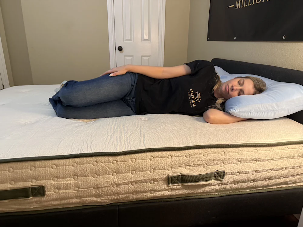 Side sleeper testing pressure relief on the Avocado Green mattress