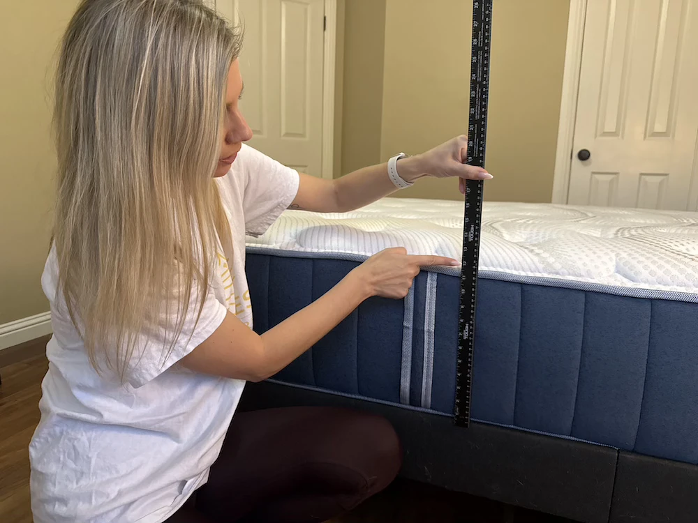 Measuring the height of the Bear Elite Hybrid mattress during hands-on testing