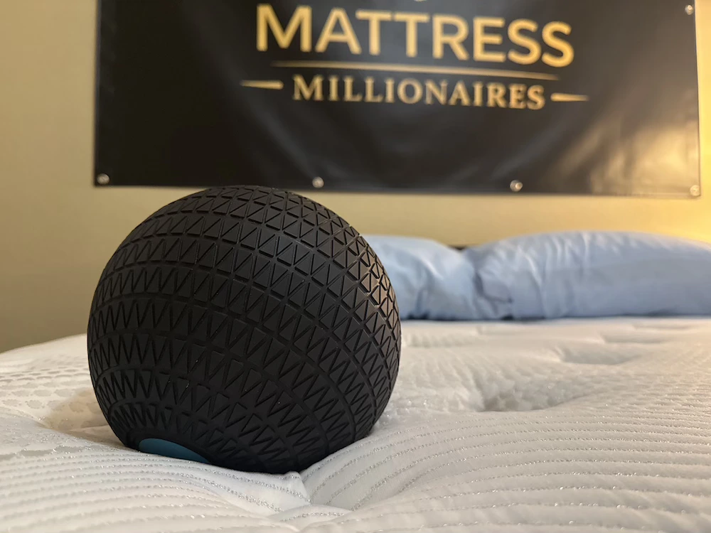 Test ball compressing the quilted surface of the Bear Elite Hybrid mattress