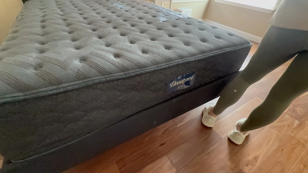 Side profile of the Beautyrest Level One Medium mattress on a platform bed