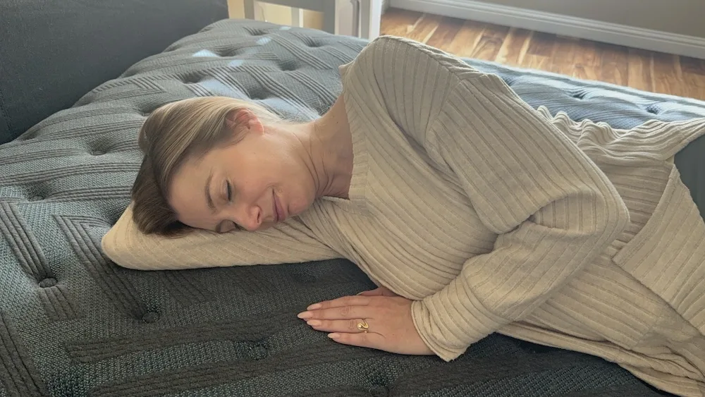 Side sleeper testing pressure relief on the Beautyrest Level One Medium mattress