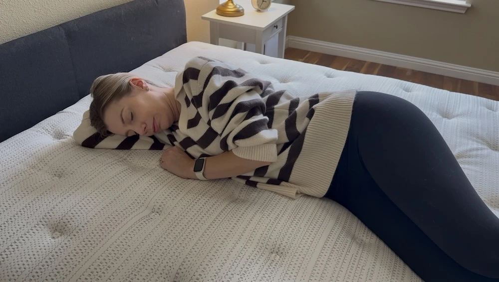 Side sleeper testing pressure relief on a quilted Beautyrest mattress