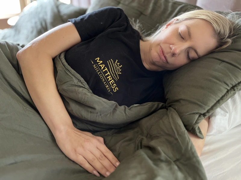 Person sleeping comfortably on their left side to reduce nighttime acid reflux and GERD symptoms.