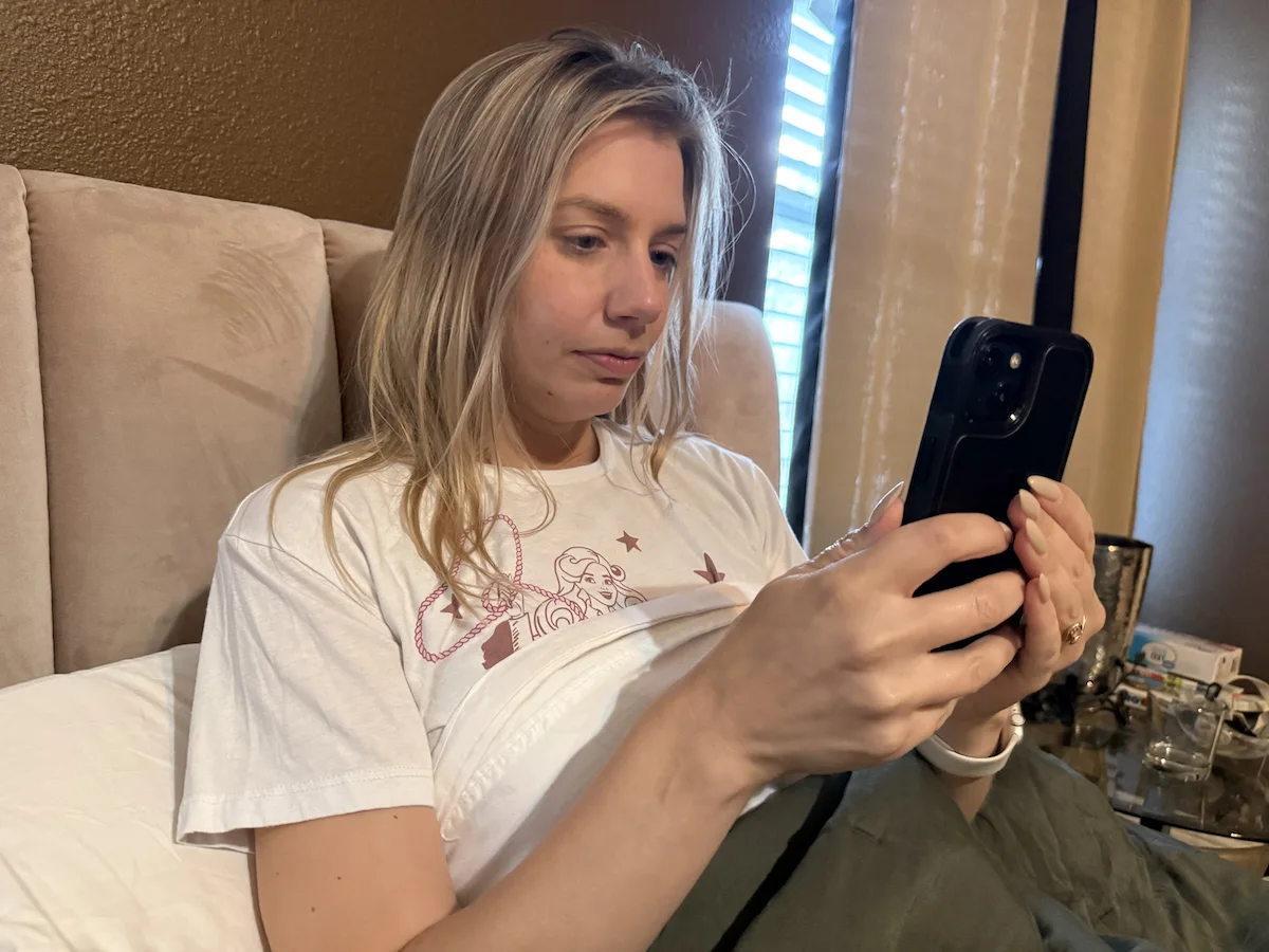Woman using a smartphone in bed before sleep