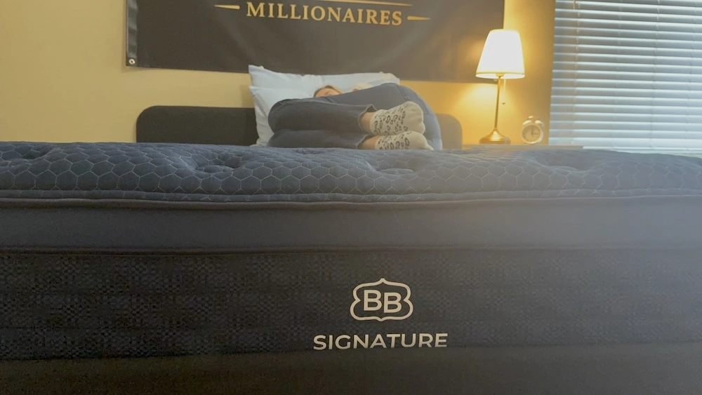 Side sleeping on Brooklyn Bedding Signature Hybrid showing pressure relief at shoulders and hips