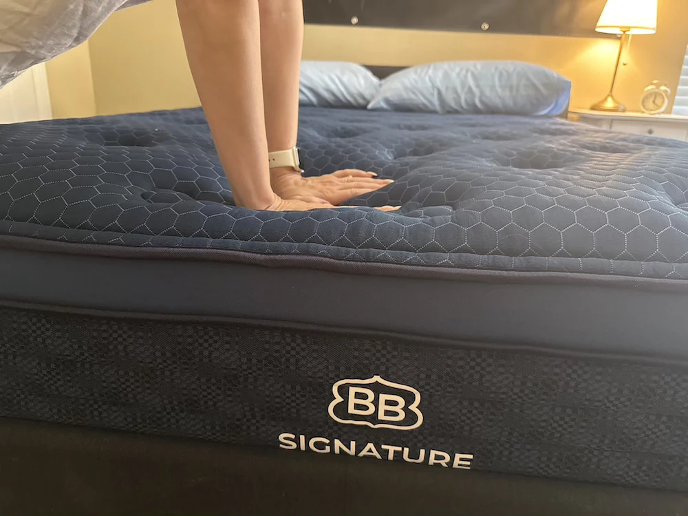 Close-up of Brooklyn Bedding Signature Hybrid quilted cover during hands-on comfort test