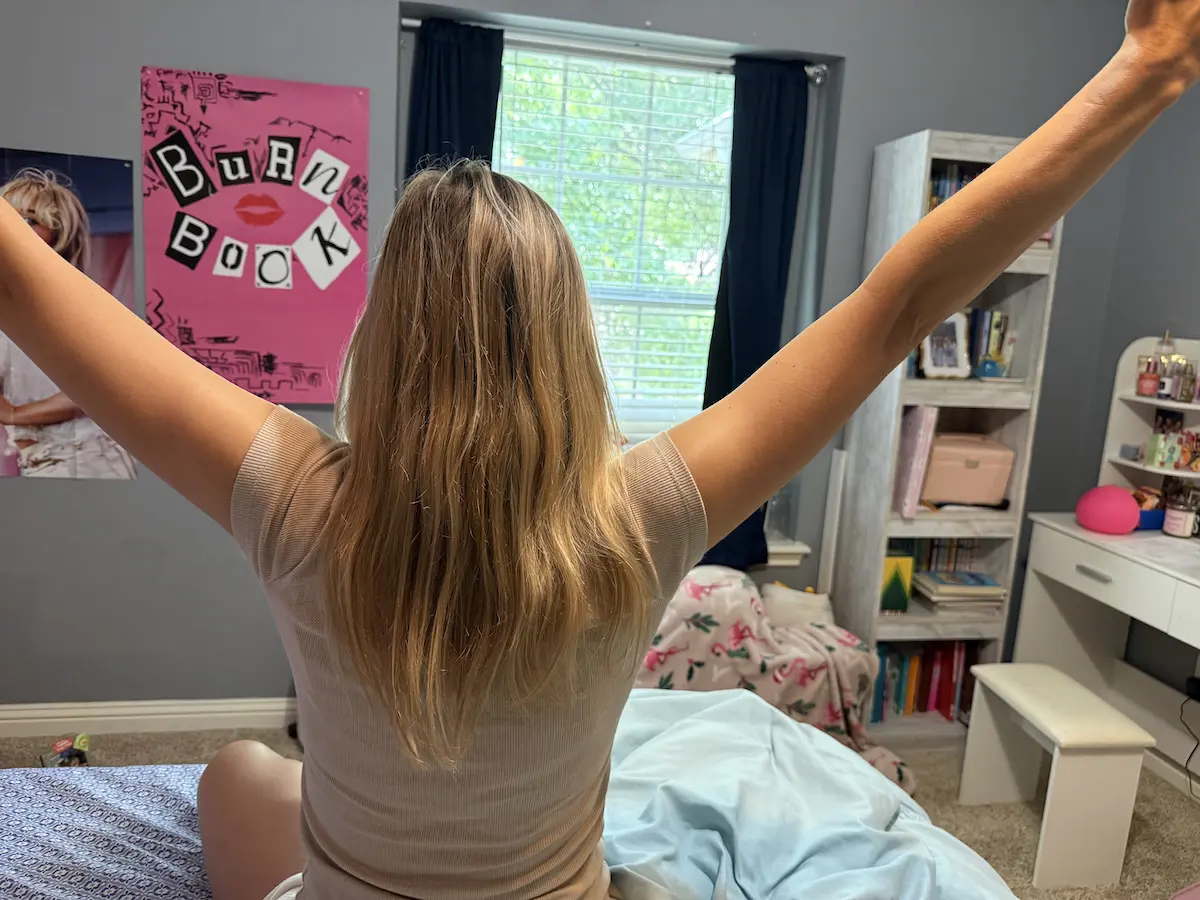 Person waking up at a consistent time to support a healthy circadian rhythm.