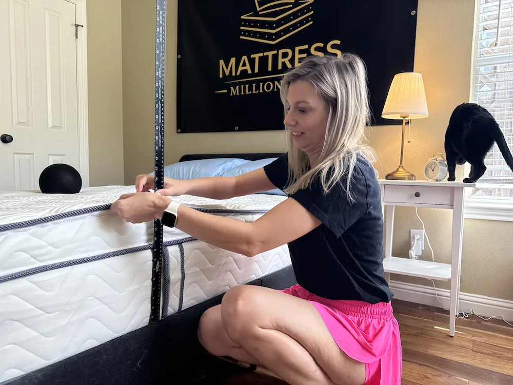 Tester measuring DLX Premier Hybrid edge support with a ruler