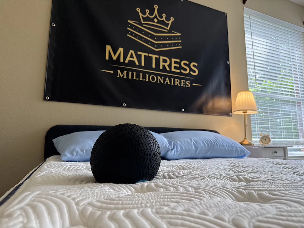 Black ball on DLX Premier Hybrid mattress during motion isolation testing
