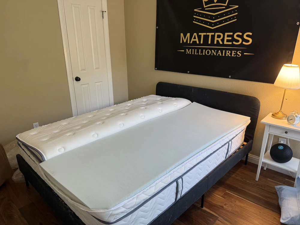 DLX Premier Hybrid mattress with split firmness foam insert during Mattress Millionaires testing