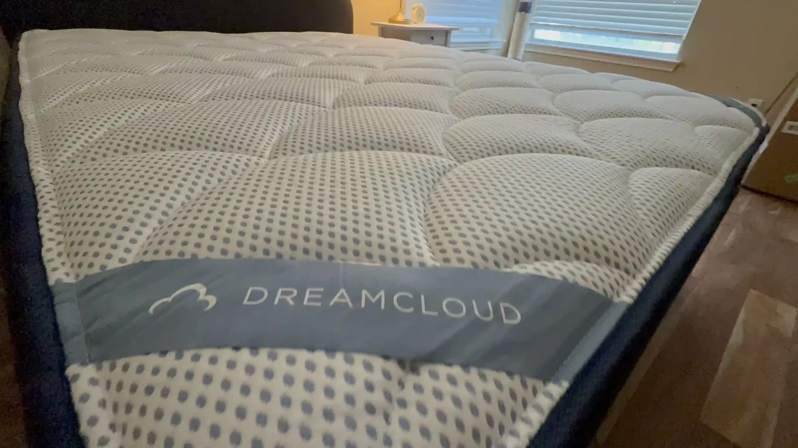 Close-up of a quilted DreamCloud mattress top showing a breathable padded surface