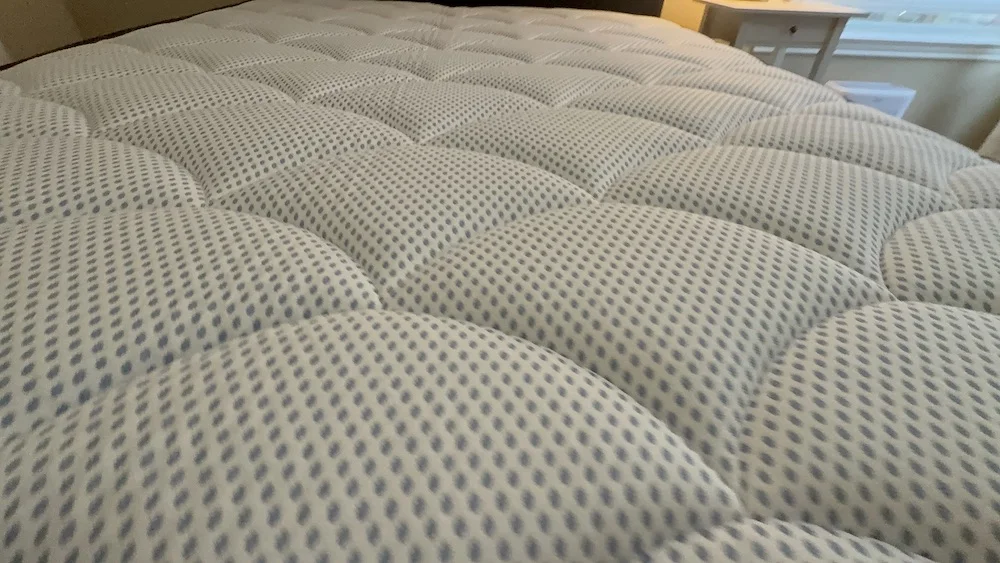 Close-up of DreamCloud Premier quilted euro top showing plush cushioning and texture