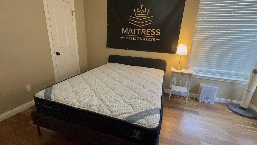 Full view of the DreamCloud Premier mattress in the Mattress Millionaires test room