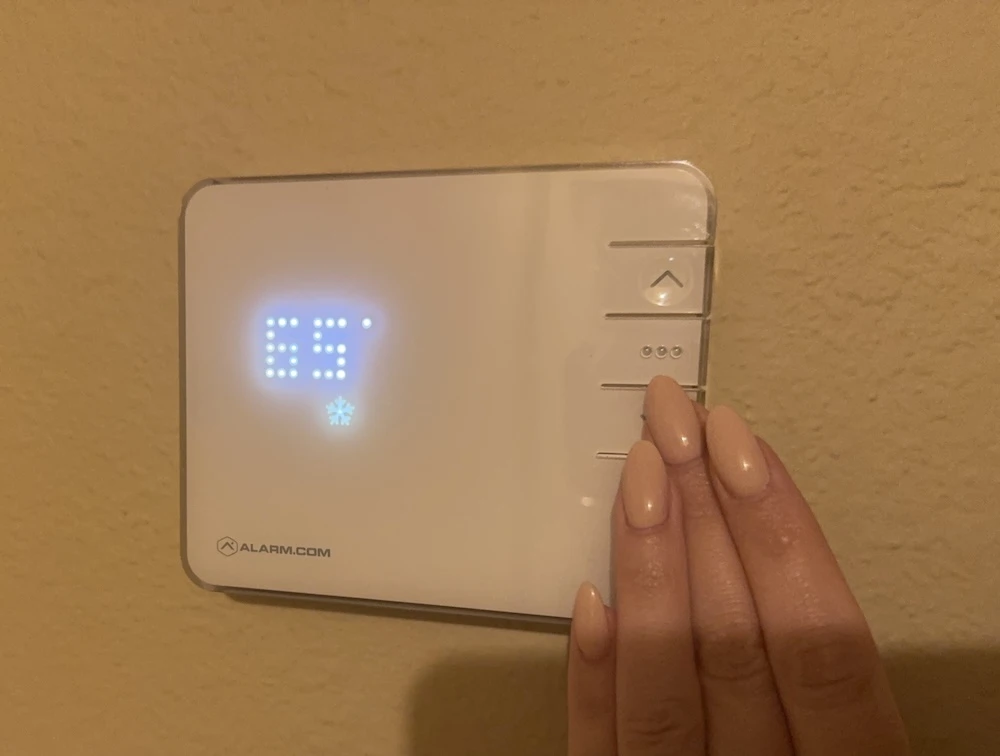 Thermostat set to 65 degrees for optimal sleep temperature