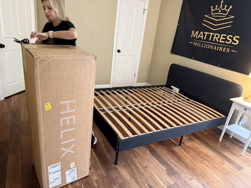 Helix Midnight shipping box standing in bedroom before setup