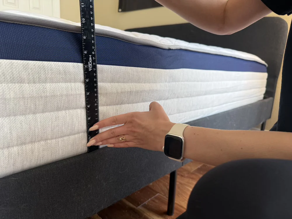 Tester measuring Helix Midnight edge support compression with a ruler