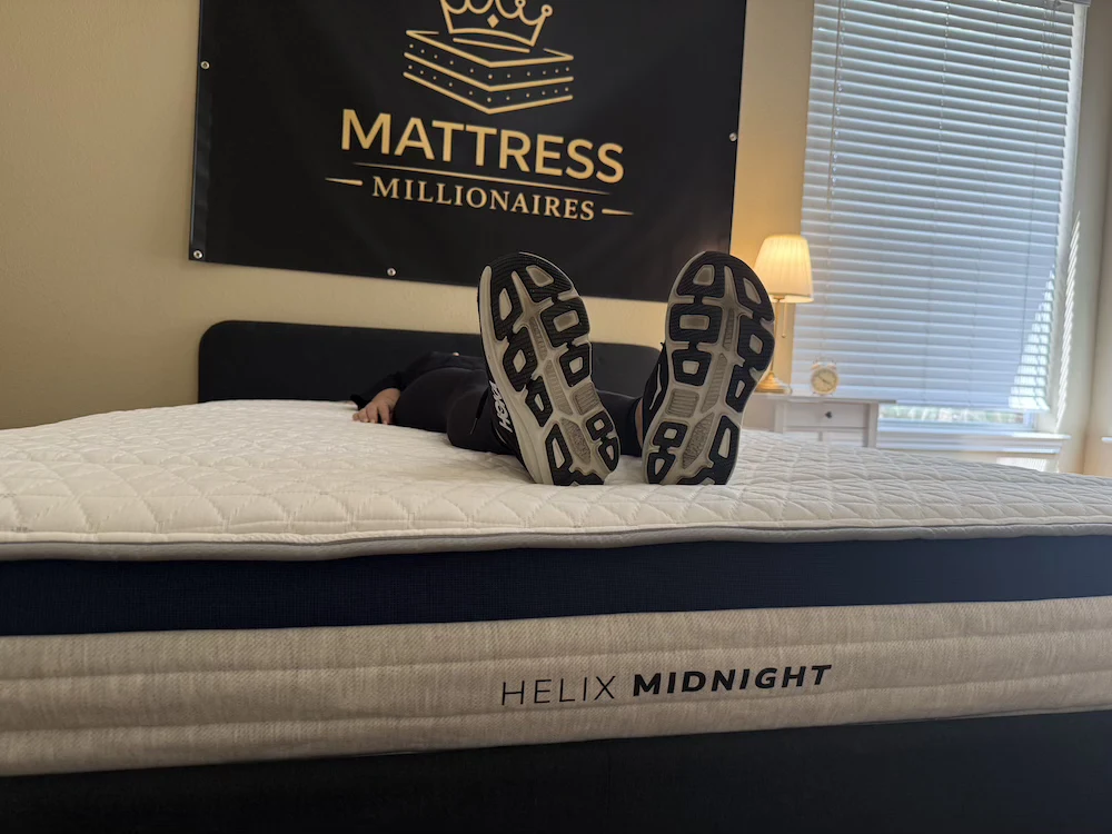 Helix Midnight mattress in Mattress Millionaires test room with branded side panel visible