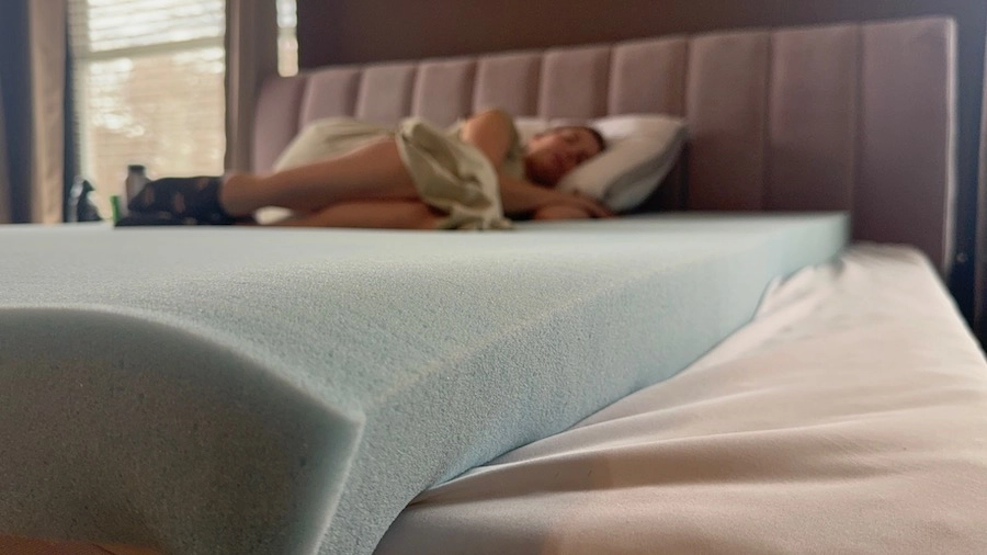 An image of a woman sleeping on memory foam.