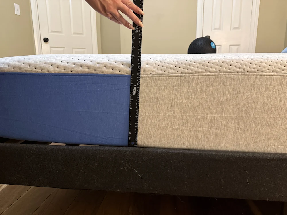 Ruler measuring mattress height difference to check for sagging depth