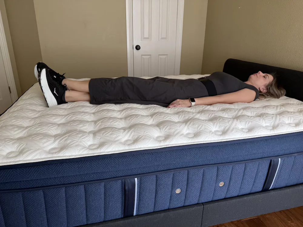 Back sleeper lying on the Kirkland Lakeridge Pillow Top during support testing