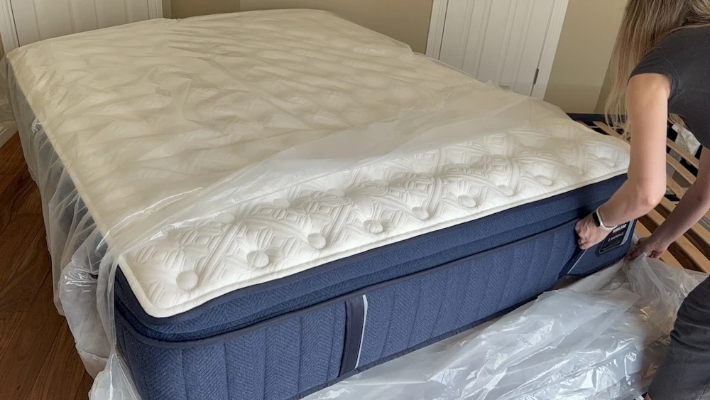 Kirkland Lakeridge Pillow Top mattress being unwrapped on a bed frame after delivery
