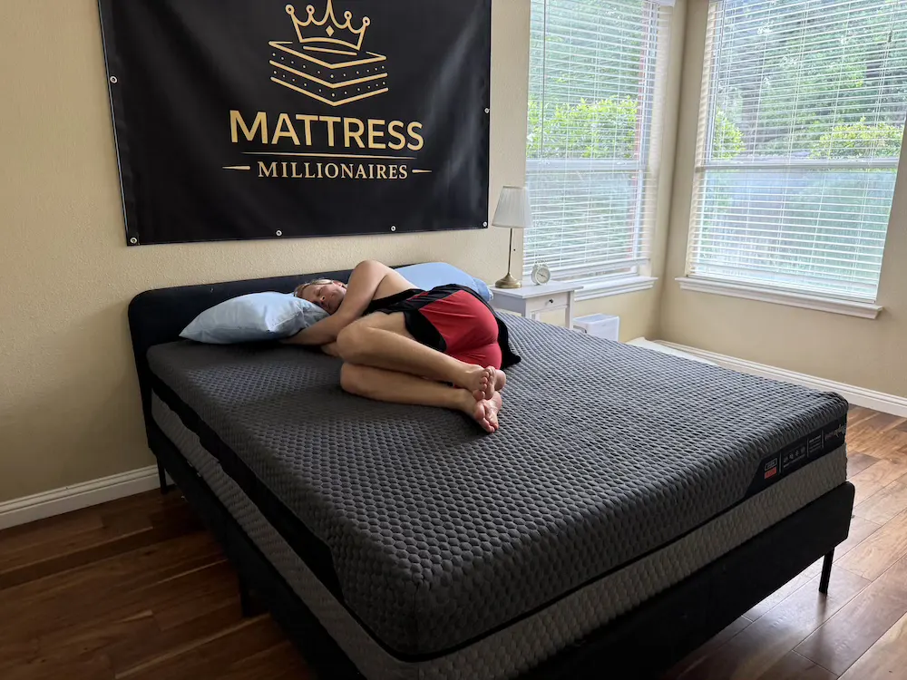 Side sleeper testing pressure relief on the Layla Hybrid mattress