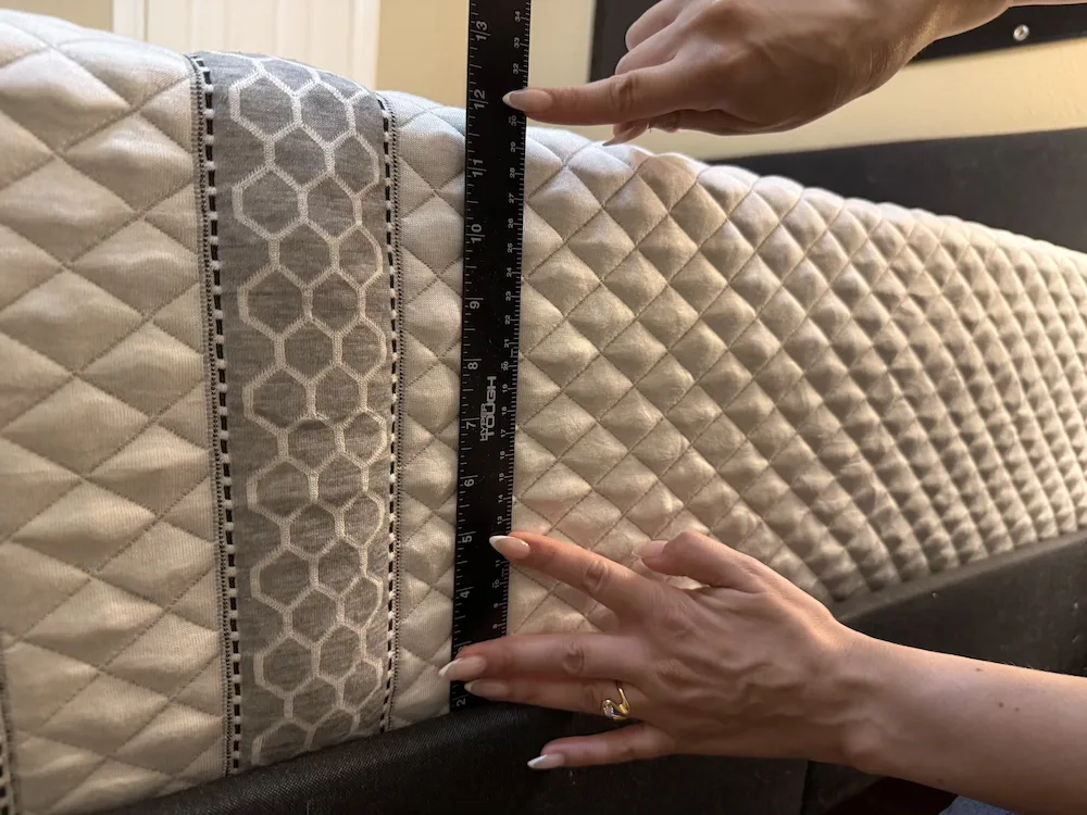 Measuring the height of the Leesa Sapira Hybrid tight-top mattress after expansion