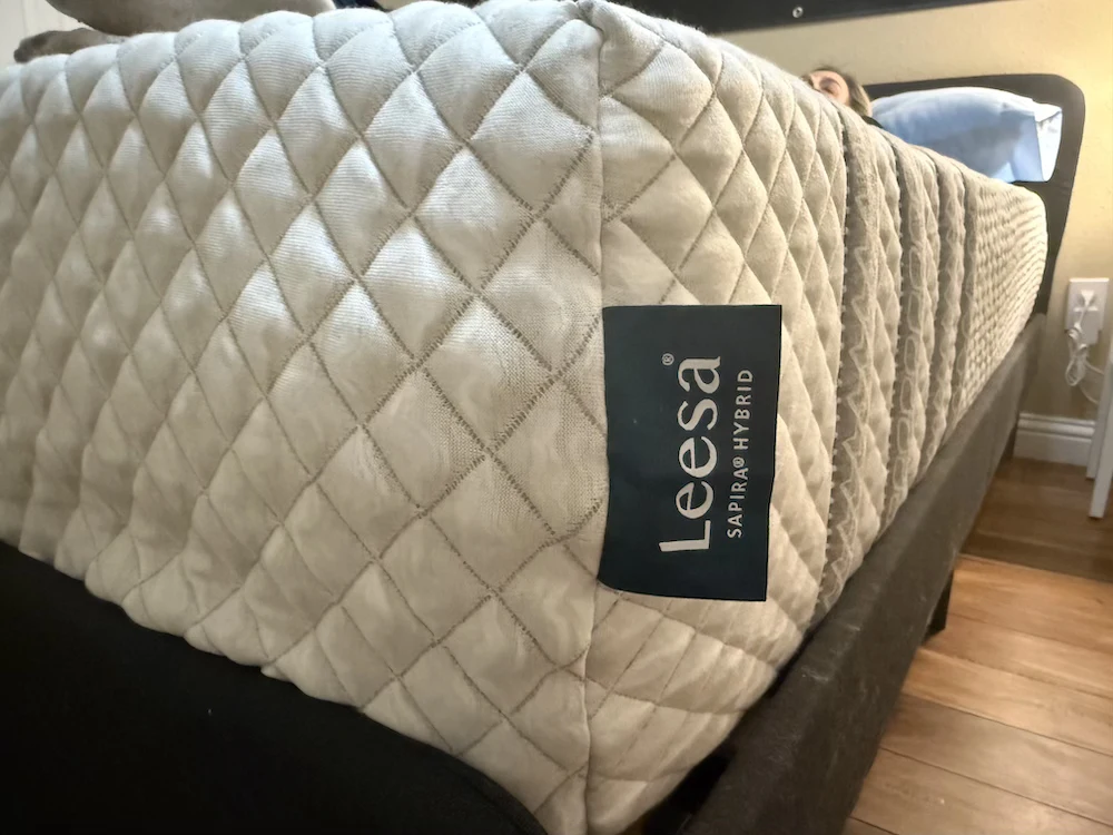 Close-up of the Leesa Sapira Hybrid logo and quilted side panel