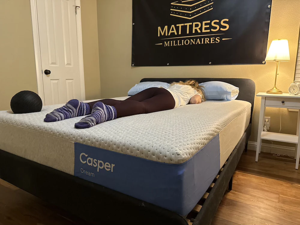 Stomach sleeper testing support on the Casper Dream mattress