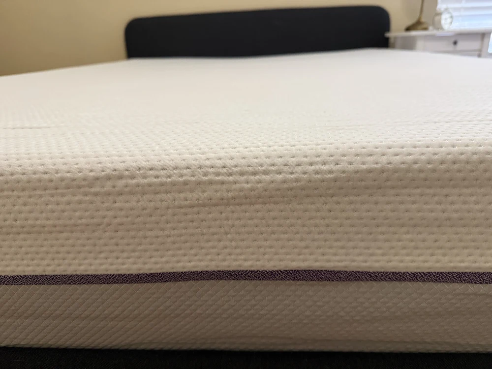 Side view of mattress showing edge support and layered construction