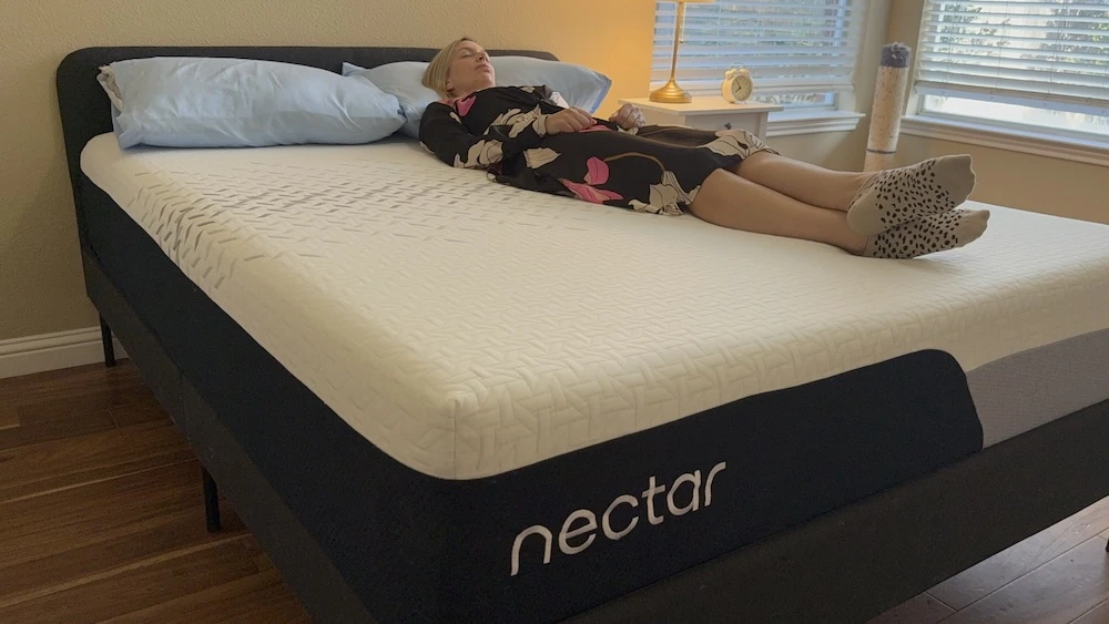 Back sleeping on Nectar Premier mattress showing body contouring and spinal alignment