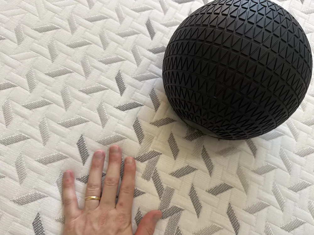Weighted ball on the Nectar Premier mattress during motion isolation testing