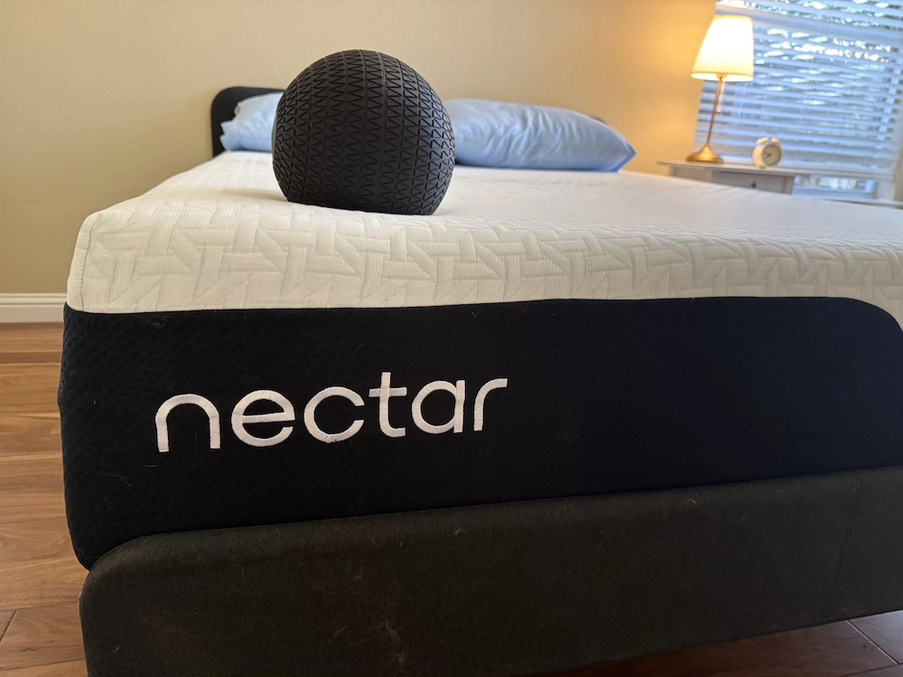 Nectar Premier mattress surface during hands-on testing with weighted ball