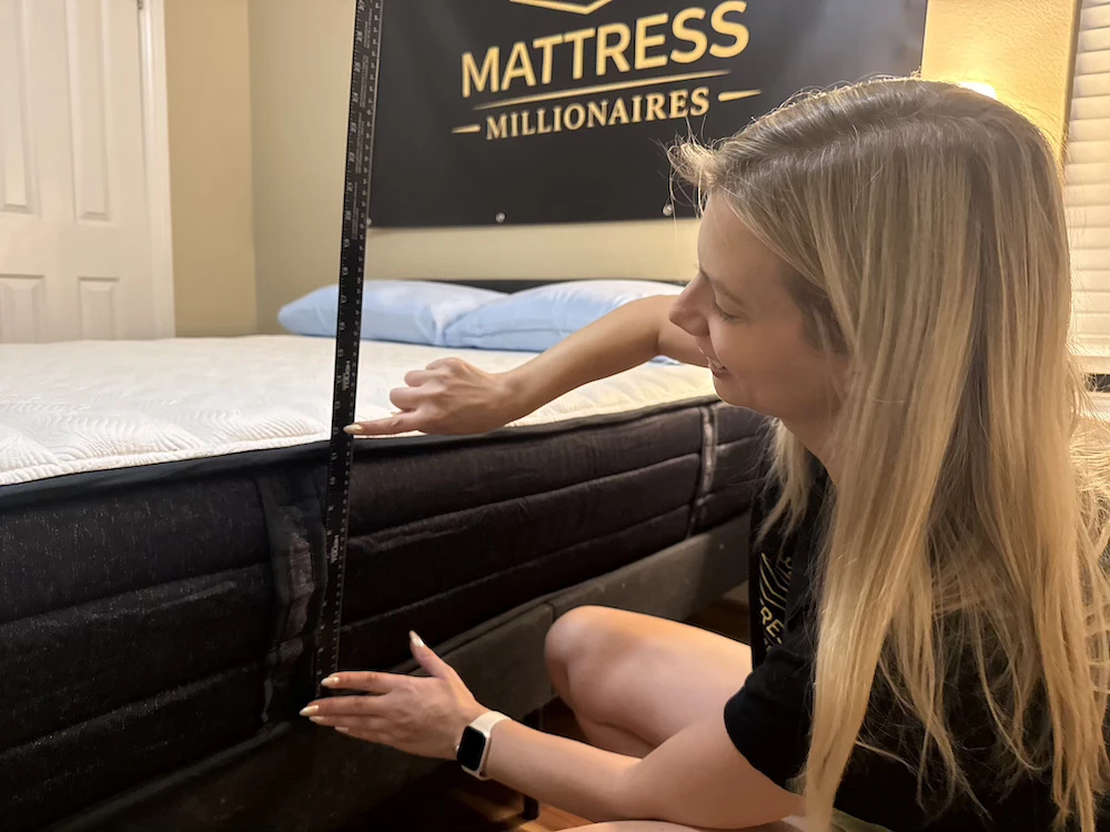 Measuring the expanded height of the Origin Adapt Hybrid mattress with a ruler