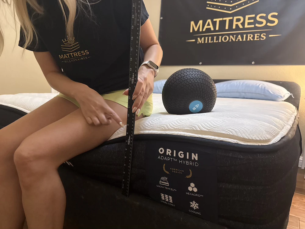 Seated edge support test measuring compression on the Origin Adapt Hybrid mattress