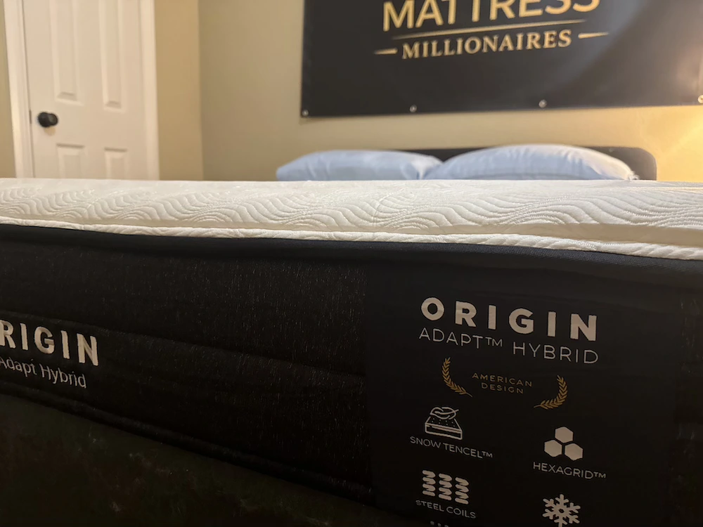 Origin Adapt Hybrid mattress side profile and branded construction panel