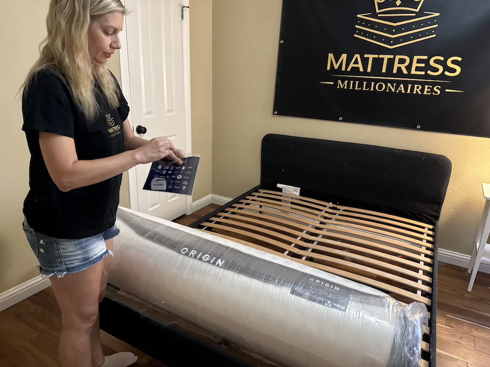 Tester reviewing Origin Adapt Hybrid setup instructions before unboxing