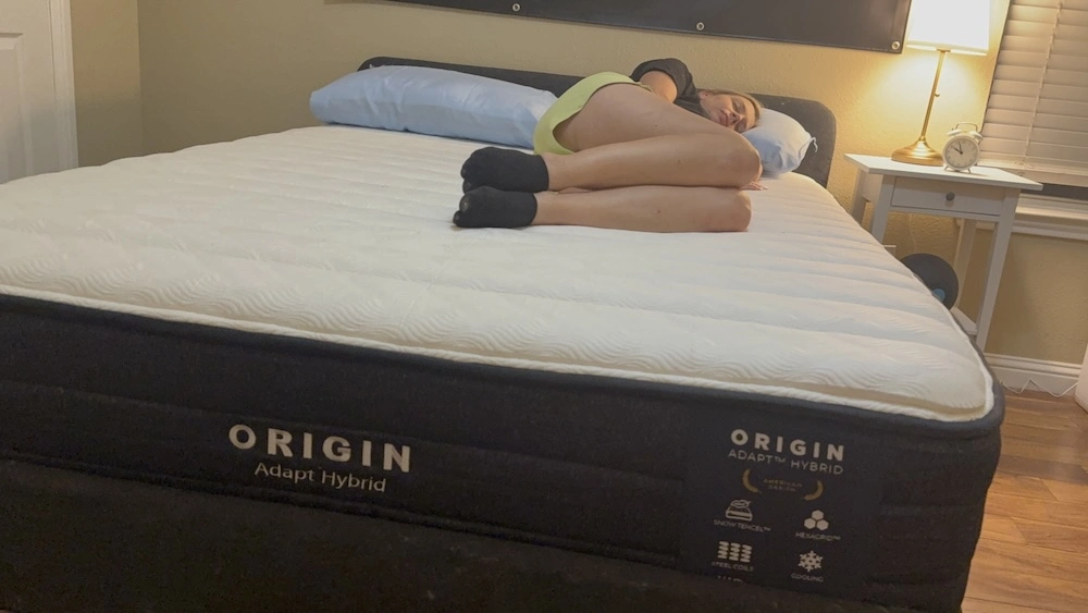 Side sleeper testing pressure relief on the Origin Adapt Hybrid mattress
