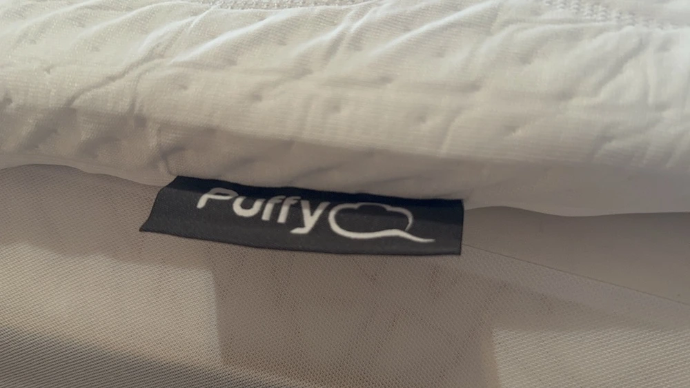 Side profile of Puffy Deluxe Mattress Topper showing thickness and construction