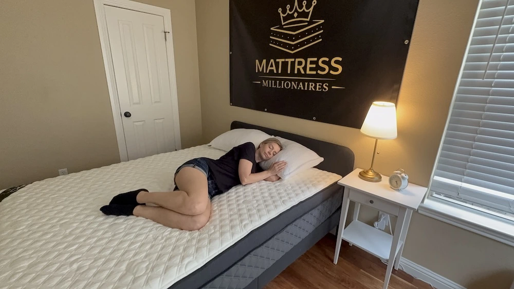 Side sleeper testing the Puffy Lux Hybrid mattress