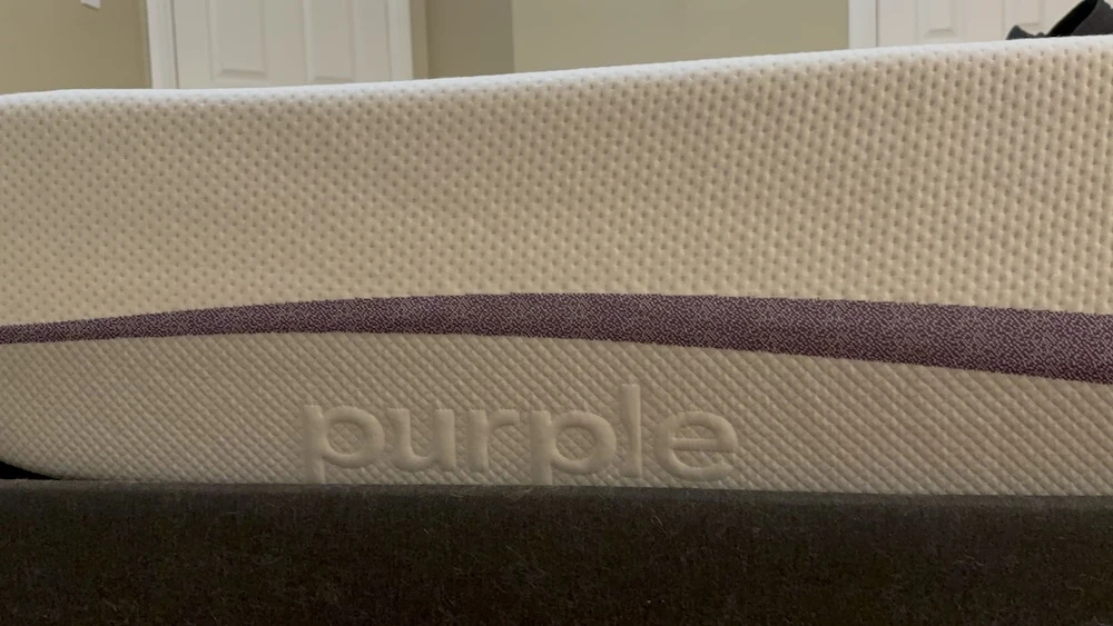 Close-up of Purple logo on mattress side panel