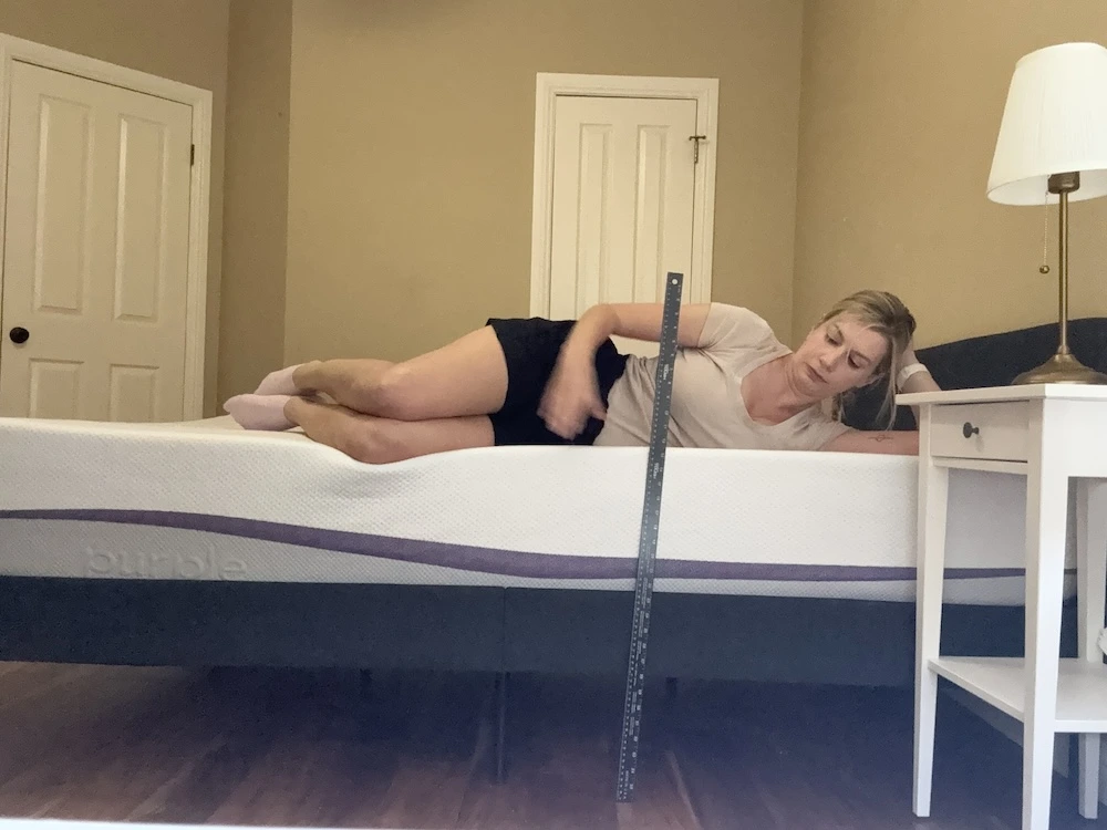 Side sleeping test on Purple Plus mattress showing spinal alignment and pressure relief