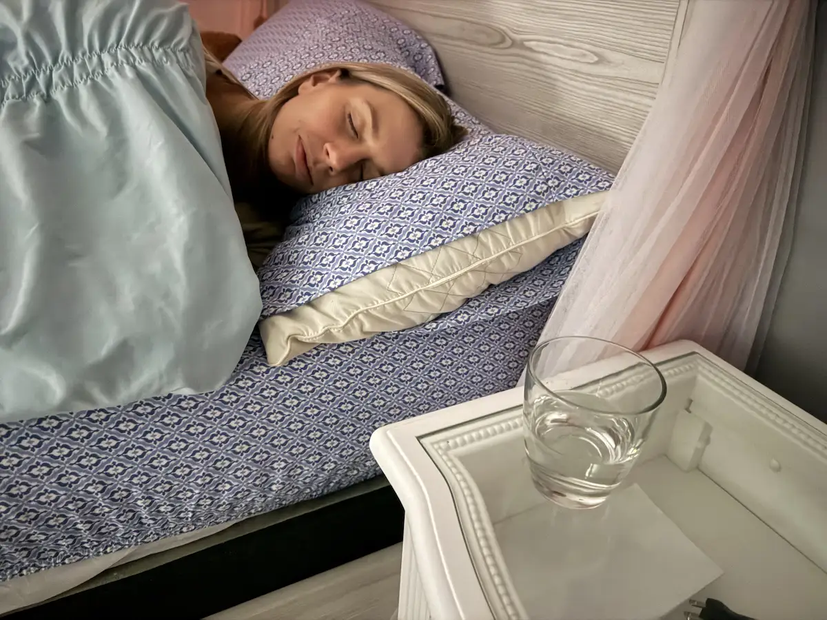 Person sleeping comfortably during restorative nighttime sleep.