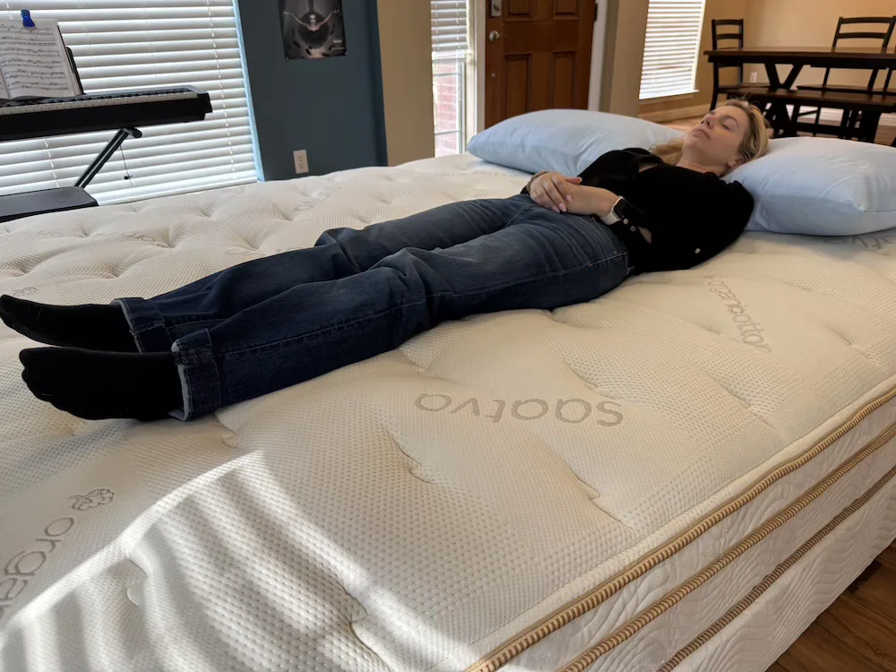 Back sleeper testing support and spinal alignment on the Saatva Classic Luxury Firm mattress